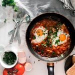 Shakshuka with eggs nestled in a red tomato sauce
