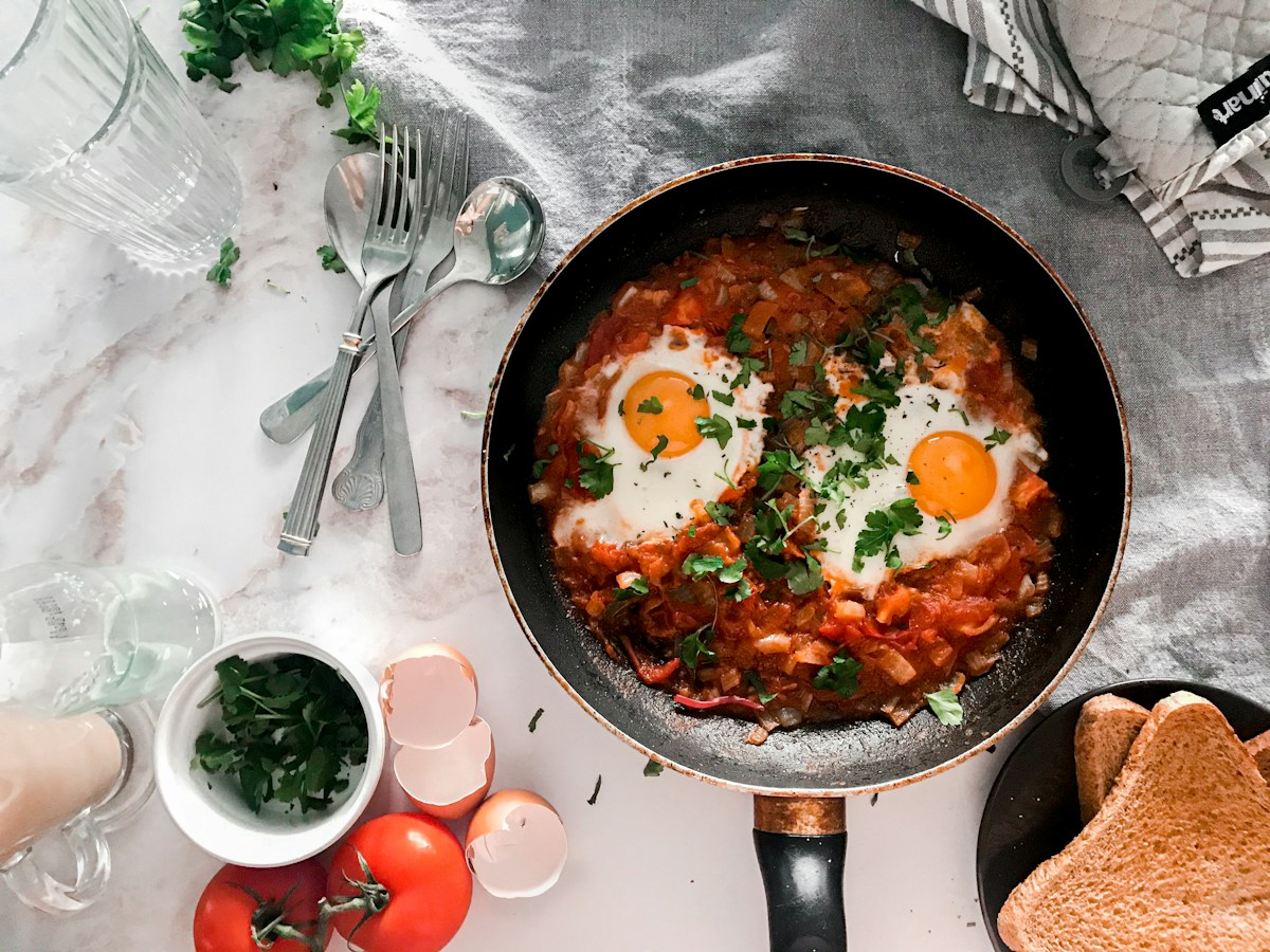 Shakshuka with eggs nestled in a red tomato sauce