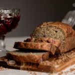 Sliced banana bread on a wooden board