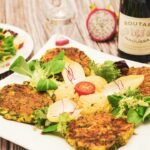 Zucchini fritters served with greens and dip